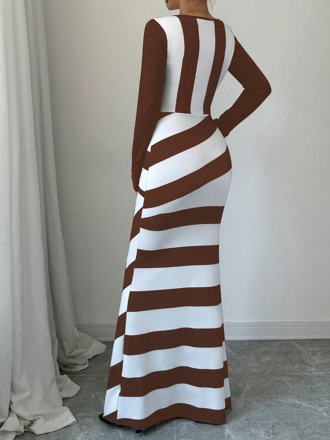 Elevate your style with our elegant Chic Colorblock Striped V-Neck Fish Tail Dress. Featuring a flattering fitted design and extra long length, this dress is perfect for any occasion. With a bold color block and stylish stripes, you'll make a statement without saying a word.