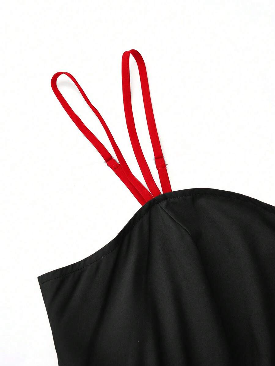Back upper bodice close up of black satin dress with red adjustable spaghetti straps