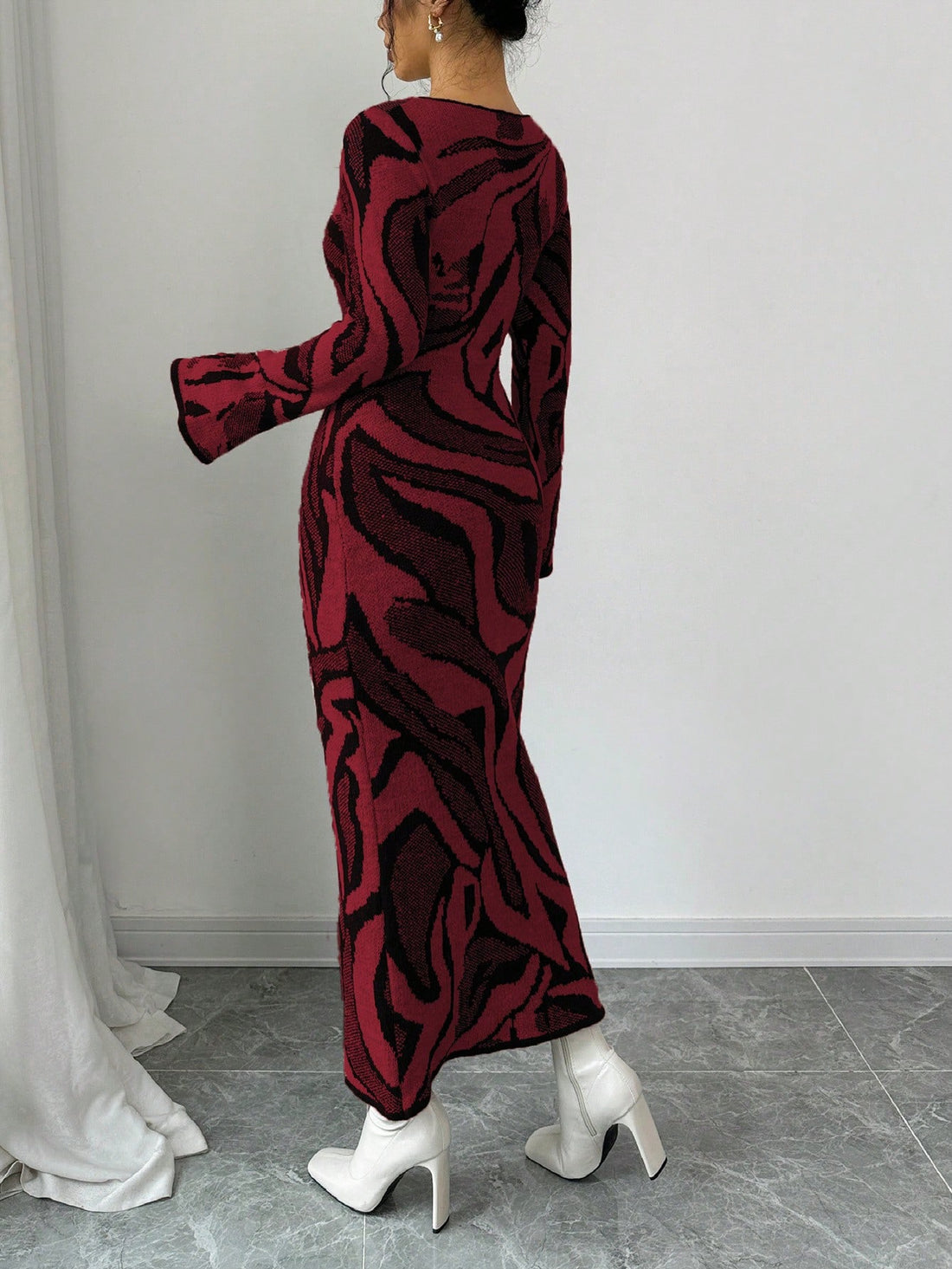 Elevate your style effortlessly with our Chic Flared Sleeve Graphic Sweater Dress. Crafted with a stylish graphic design and flared sleeves, this dress adds a touch of sophistication to any outfit. Made with quality materials, it offers both comfort and style in one.