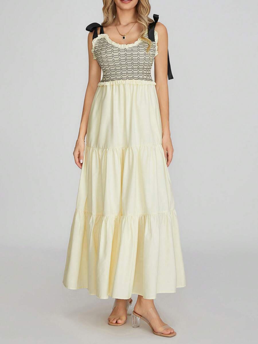 Effortlessly stylish for summer, this abstract print dress features a V-neck and sleeveless design. Perfect for any occasion, it's a must-have for your wardrobe. Stand out in chic style!