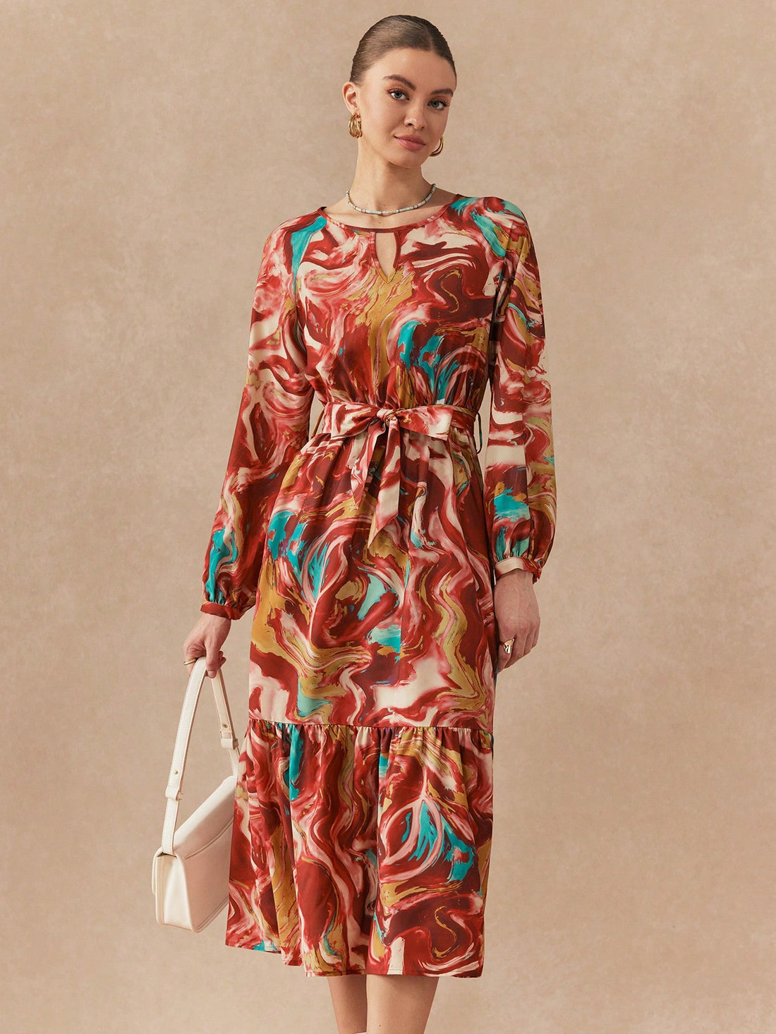 Twirl into autumn in this stunning printed long dress that's equal parts sophisticated and fun. The graceful round neckline frames your face beautifully, while the flowing silhouette glides with every step. Perfect for everything from casual coffee dates to evening gatherings, this versatile piece brings effortless elegance to your fall wardrobe. The eye-catching print adds personality without sacrificing that polished, put-together vibe you're after. Slip it on and feel the confidence boost that comes with