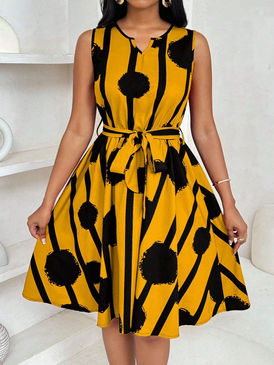 Channel your inner fashionista with this Chic & Elegant Geometric Print Tie-Waist Flared Mini Dress. Featuring a flattering tie-waist design and a fun geometric print, this dress will have you turning heads wherever you go. Perfect for a night out or a special event, this dress will add some flair to your wardrobe!