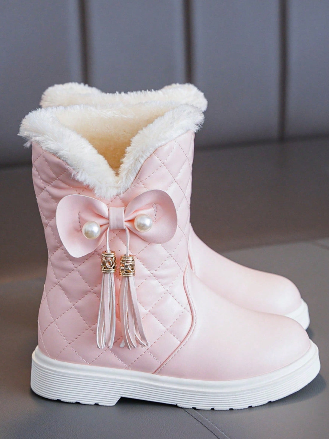 These Stylish Girls' Retro Fringe Tall Boots are perfect for keeping feet warm and cozy during the winter months. The retro fringe design adds a touch of style, while the tall height provides added warmth and protection. Don't sacrifice fashion for comfort with these must-have winter footwear essentials.