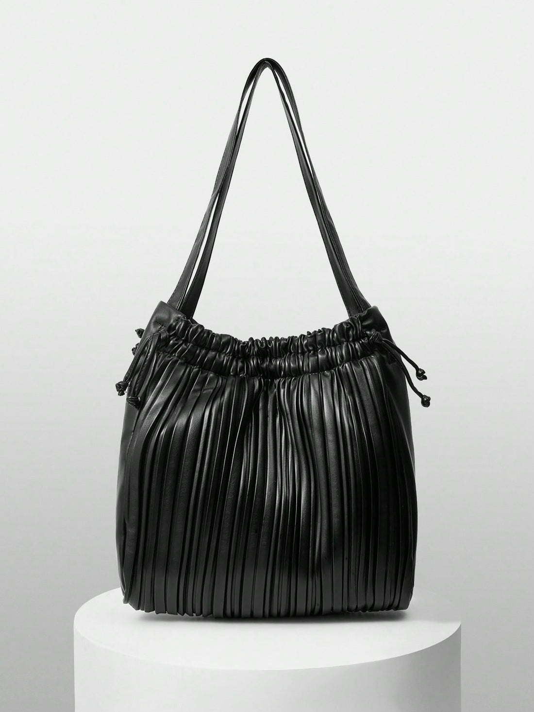 Add a splash of fun to your outfit with this versatile solid color pleated drawstring shoulder bag. Its playful pleats and easy drawstring closure keep your essentials secure while adding a chic twist to your look. Perfect for fashionistas who love style and convenience in one delightful package!