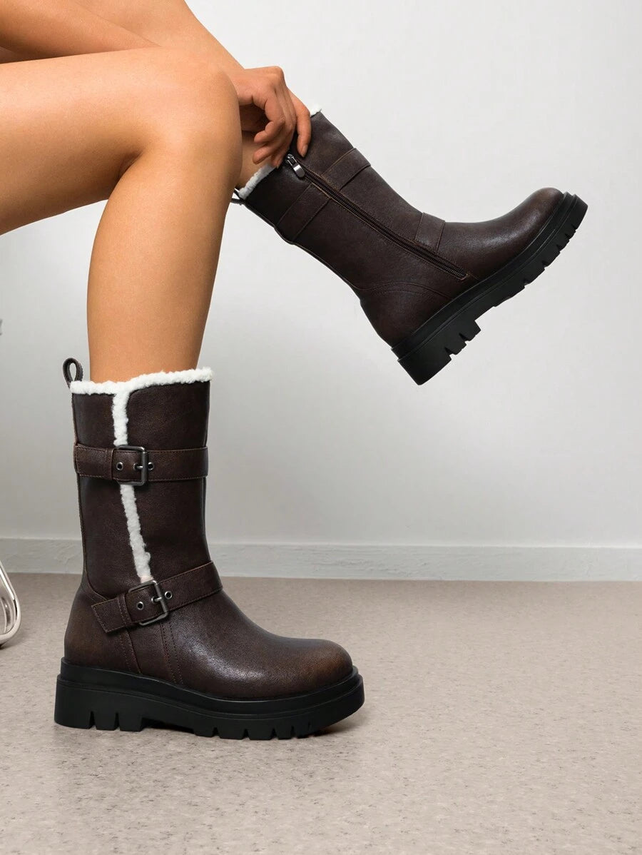 Step out in style and warmth with these playful mid-calf furry snow boots! Featuring an adjustable buckle strap and a convenient side zipper, they’re perfect for keeping cozy while turning heads all winter long. Whether you're braving snowy streets or cozying up by the fire, these boots add a fun, fashionable touch to your cold-weather wardrobe.