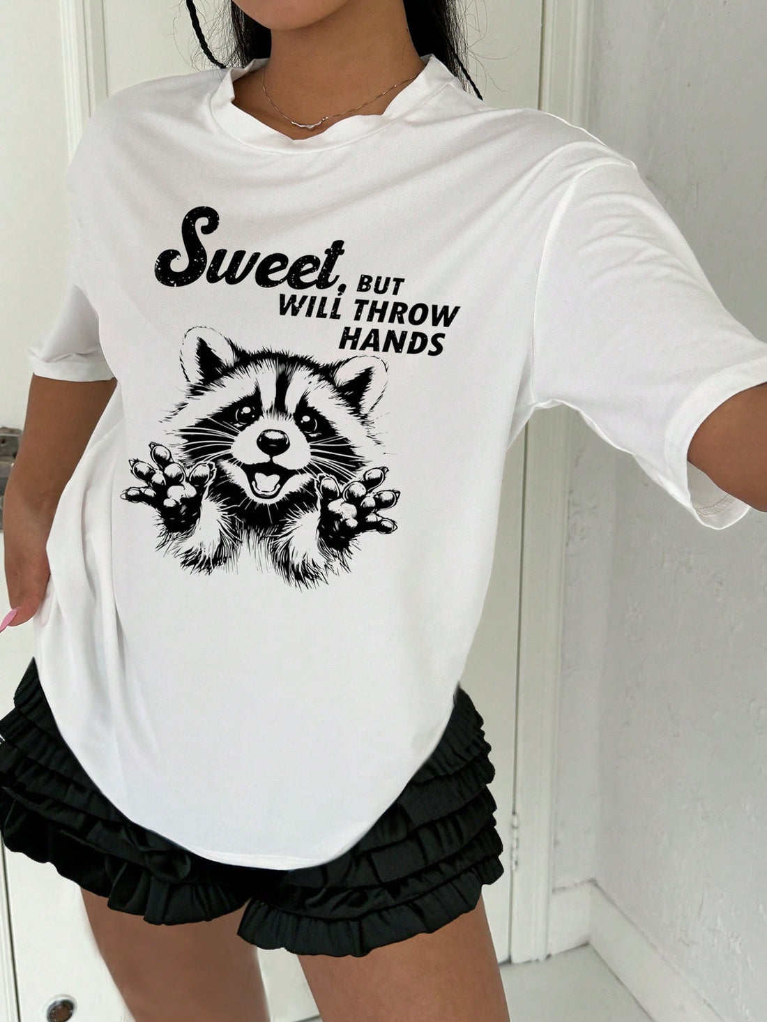 Effortless style and maximum comfort collide in our Chic & Comfy Raccoon Letter Print Tee. The minimalist design showcases the playful charm of these clever creatures, while the soft, lightweight fabric keeps you cool and comfortable all day long. Perfect for any casual occasion, this tee is a must-have for any stylish wardrobe.