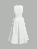 Back view of white midi dress with center seam and full skirt
