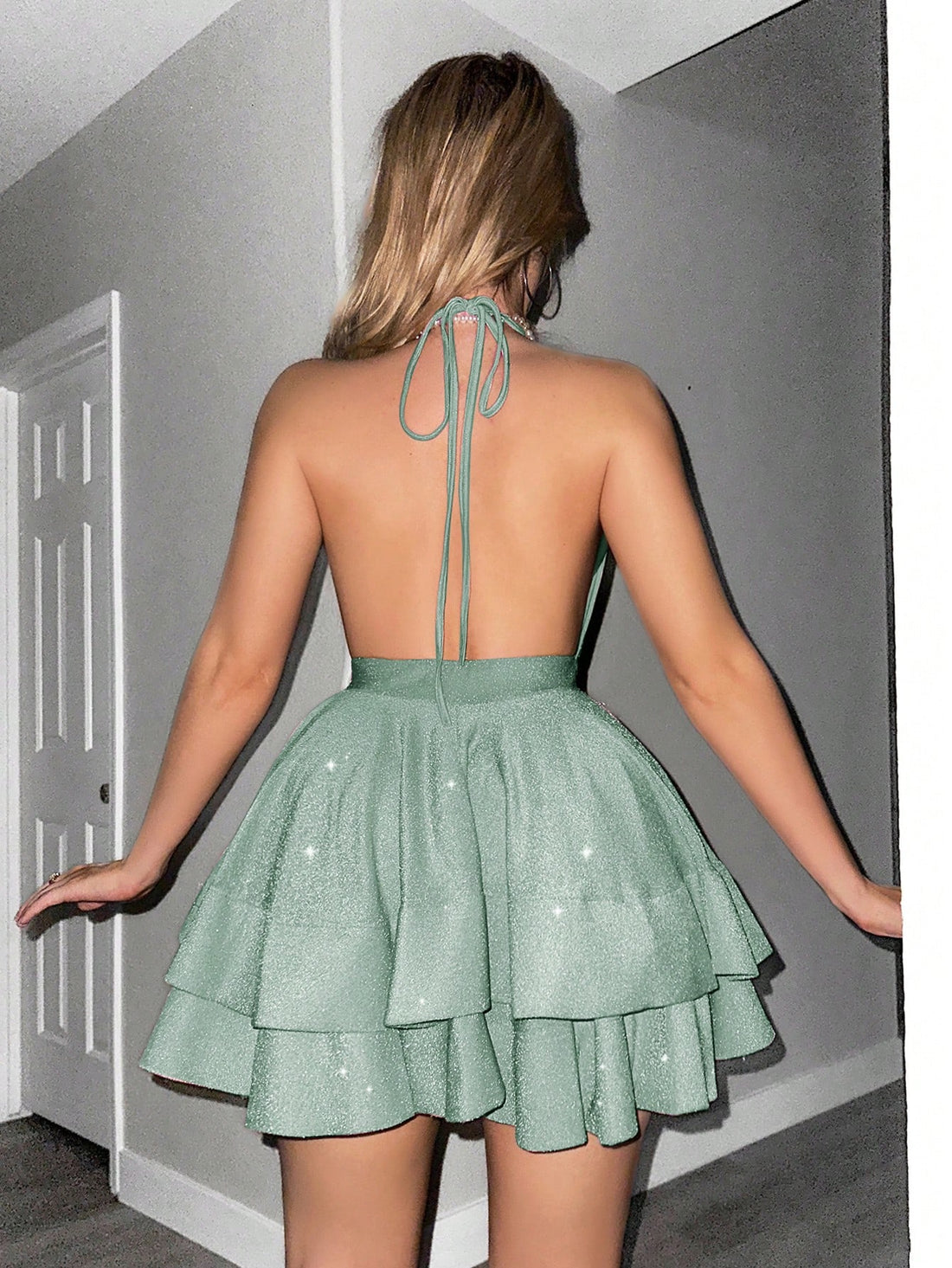 Make a statement at any event with our Elegant Shiny Deep V-Neck Ruffle Hem Dress. The shiny fabric and stunning deep v-neckline will turn heads while the ruffle hem adds a touch of sophistication. Perfect for any occasion, this dress will make you feel confident and beautiful.