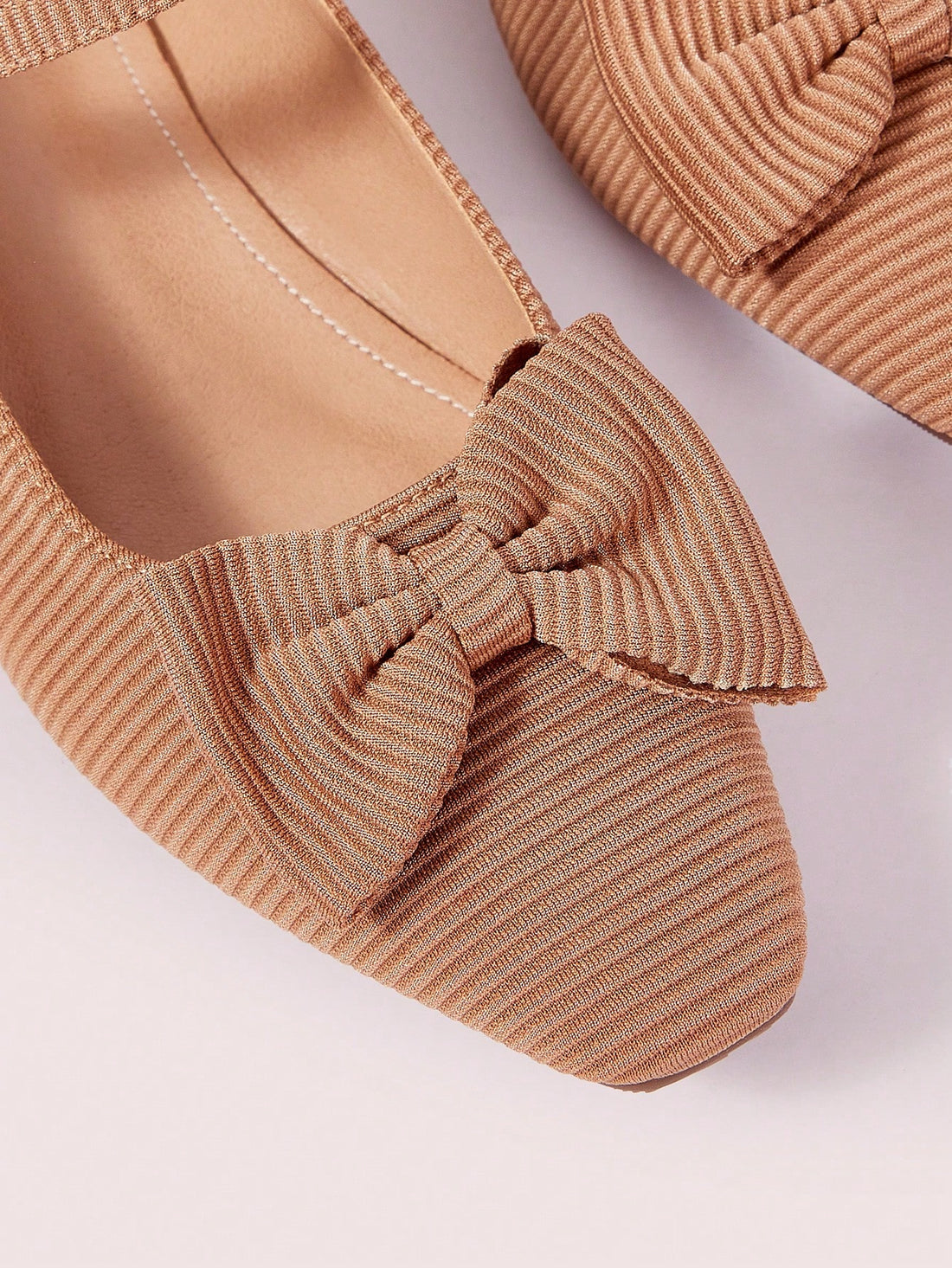 Effortlessly elevate your daily style with our Chic Apricot Striped Bow Slip-On Flats. The chic apricot stripes and elegant bow add a touch of sophistication to your look. Slip them on for a comfortable and stylish ensemble, perfect for any occasion.