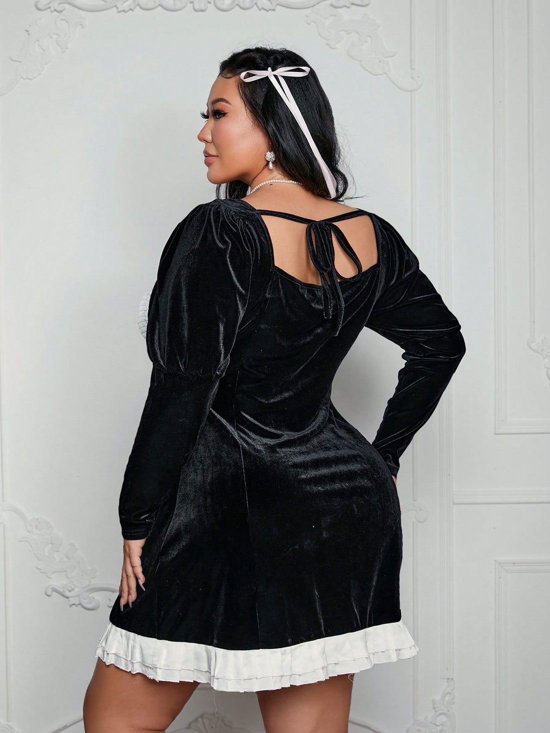 Turn heads at evening and holiday parties with this Elegant Plus Size Black & White Velvet Satin dress. With its long sleeves and flattering cut, you'll feel confident and stylish all night long. Perfect for showing off your curves and making a statement, this dress is a must-have in your wardrobe.
