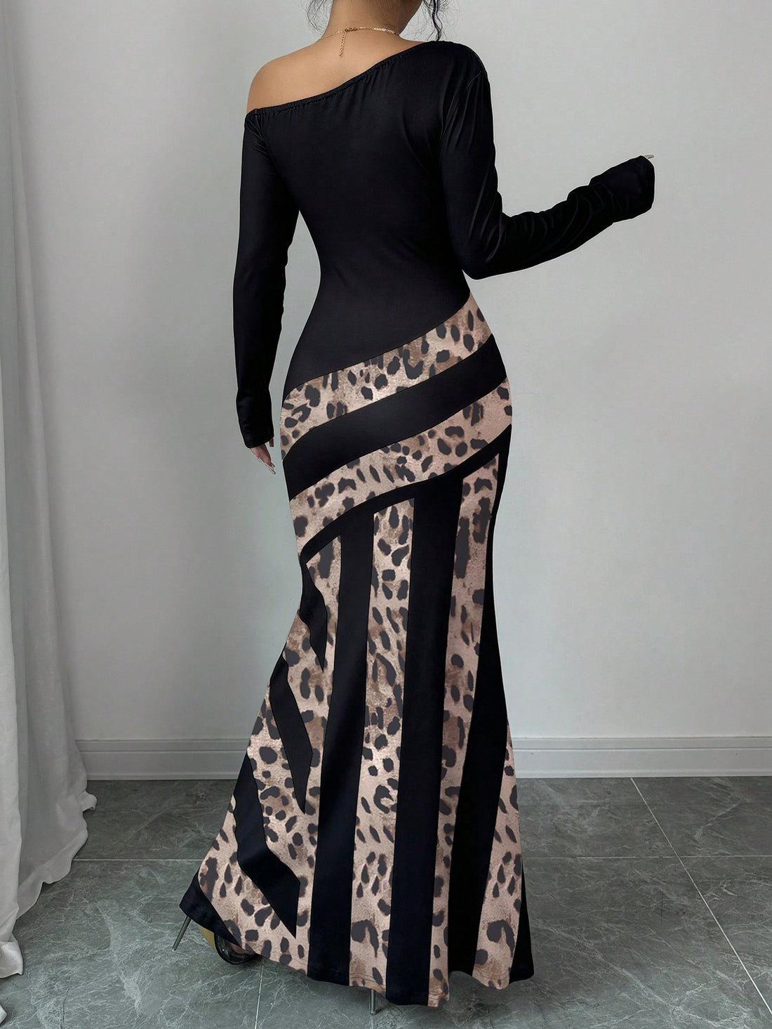 Introducing our Chic Leopard Patchwork Fishtail Dress, featuring a stylish V-neck design for a sultry look. With a unique leopard patchwork pattern, this dress is sure to make a statement. Perfect for any occasion, its flattering fishtail silhouette will enhance your curves. Upgrade your wardrobe with this must-have piece.