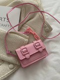 Front style view of mini bag in soft pink tone with acrylic detail
