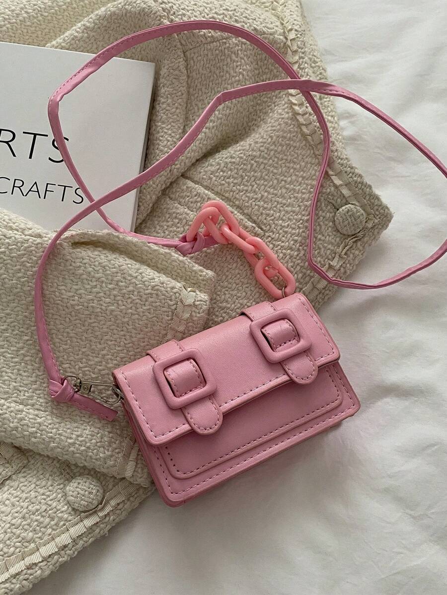 Front style view of mini bag in soft pink tone with acrylic detail