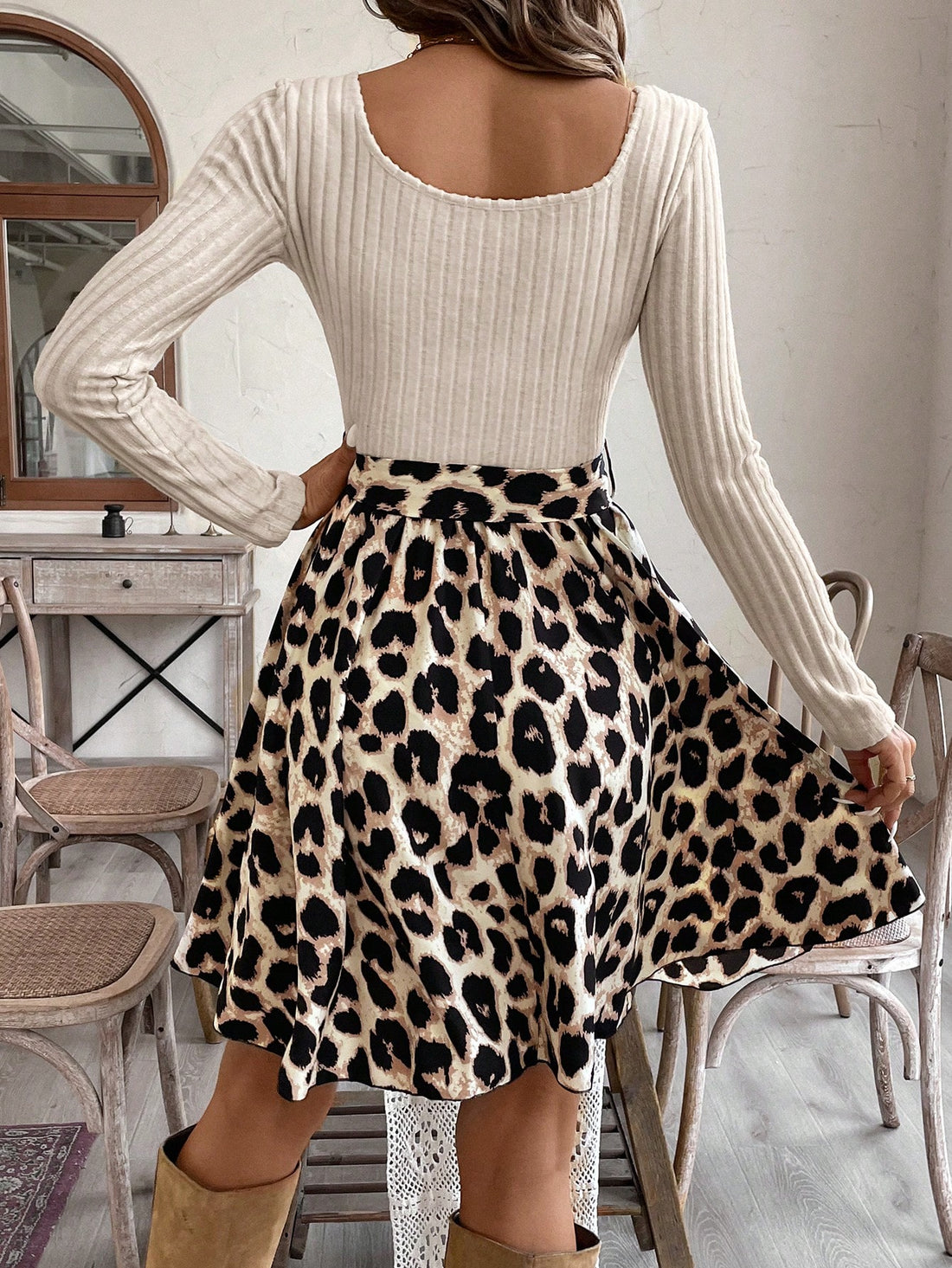 Step into style with our Chic Vintage Leopard Print A-Line Dress. This dress combines the classic print of leopard with a modern A-line silhouette, complete with a square collar and ruffle hem. Exude confidence and sophistication in this timeless piece.