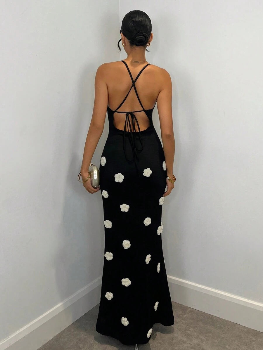 Back view black maxi dress with crossed straps open back and tie closure