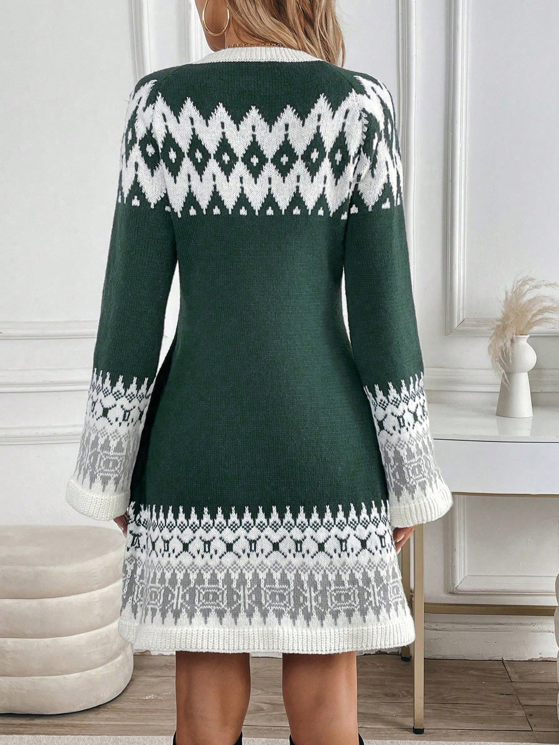 This retro-inspired Clasi V-neck sweater dress features a unique contrast color jacquard design that adds a touch of sophistication to any outfit. Made with high-quality materials, this dress is both comfortable and stylish. Perfect for any occasion, this dress is a must-have for any fashion-forward individual.