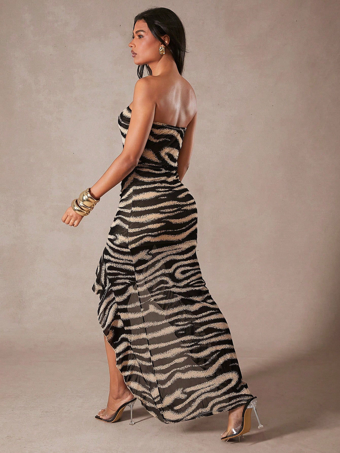 Unleash your wild side with our Chic Zebra Print Strapless Maxi Dress! Featuring a playful ruffle frill, this dress is perfect for parties and special occasions. Stand out from the crowd and turn heads with our eye-catching design. Make a statement and feel confident in this must-have dress!