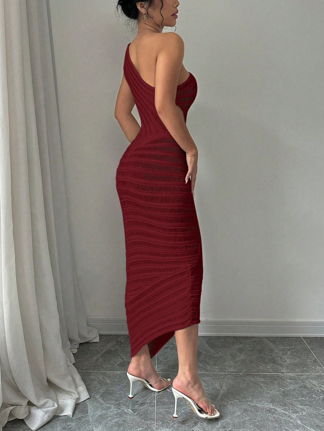 Get ready to turn heads in this chic knit dress! With a unique one-shoulder cutout and effortless elegance, this dress brings modern style to any occasion. Stand out from the crowd and make a statement in this must-have piece.