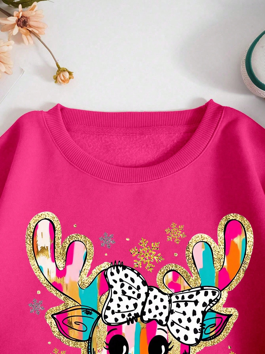 Spread some sparkling Christmas spirit with this colorful reindeer print crew neck sweatshirt for women! The eye-catching design adds a festive touch to any outfit and the comfortable fit will keep you cozy all season long. Perfect for spreading holiday cheer wherever you go!