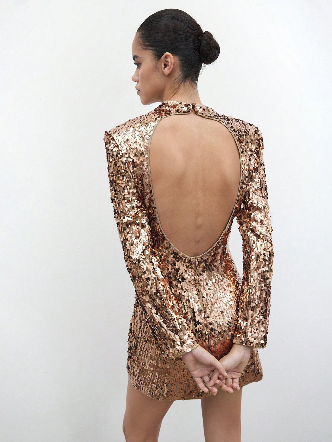 Shine bright like a golden star in this dazzling sequin mini dress! Perfect for turning heads at holiday parties, New Year's Eve celebrations, and those moments when you want to feel absolutely fabulous. The shimmering sequin fabric catches the light with every move, creating an eye-catching sparkle that demands attention. Slip it on for instant glamour without the fuss—this dress does all the heavy lifting so you can focus on having fun. Whether you're dancing the night away or making a grand entrance, thi