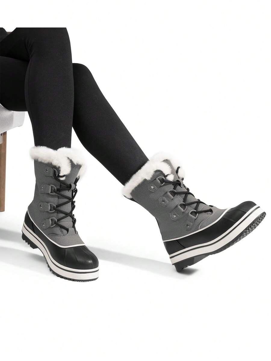 Step out in style and warmth with these Women's Mid-Calf Faux Fur Waterproof Lace-Up Boots. Designed to keep your feet cozy and dry, their plush faux fur lining adds a cuddly touch while the waterproof exterior shields you from snow and slush. The secure lace-up design offers a custom fit, and the anti-slip soles keep your footing steady on winter’s slipperiest days. Perfect for snowy adventures or cozy strolls—these boots bring both comfort and fun to chilly weather!