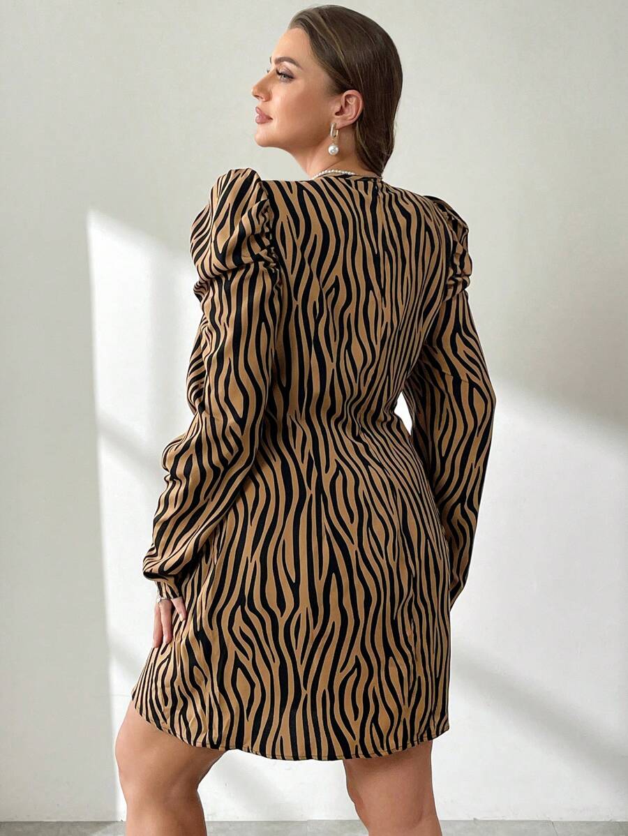 Make a bold statement in this plus-size zebra print wrap dress that effortlessly transitions from the office to festival season. The striking black and white pattern commands attention while the flattering cross-wrap silhouette hugs curves in all the right places. Versatile enough for professional settings yet fun enough for weekend adventures, this dress proves you don't have to choose between style and comfort. Dress it up with heels or down with sneakers—this wild print works with everything.