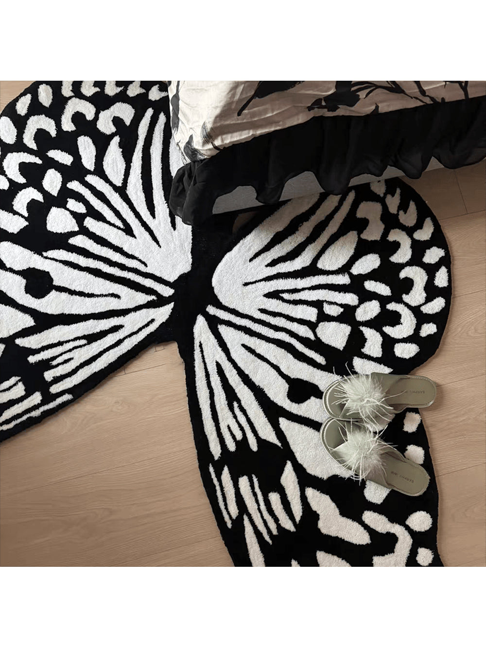 Add a touch of whimsy to any room with this adorable black and white butterfly velvet rug. Soft to the touch and featuring a non-slip backing, it’s perfect for brightening up your home or office while keeping you safe from slips. Let these charming butterflies flutter underfoot and bring playful style wherever you place it!