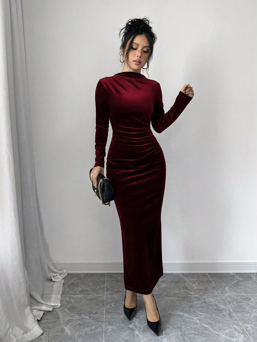Make a statement in this stunning burgundy velvet maxi dress that's equal parts sophisticated and fun. The asymmetric ruffle adds unexpected flair while the split hem keeps things flirty and modern. Luxuriously soft velvet hugs you in all the right ways, perfect for elevating your evening look or turning heads at any special occasion. Whether you're dancing the night away or enjoying an upscale dinner, this dress delivers elegance with a playful twist that says you don't take yourself too seriously.