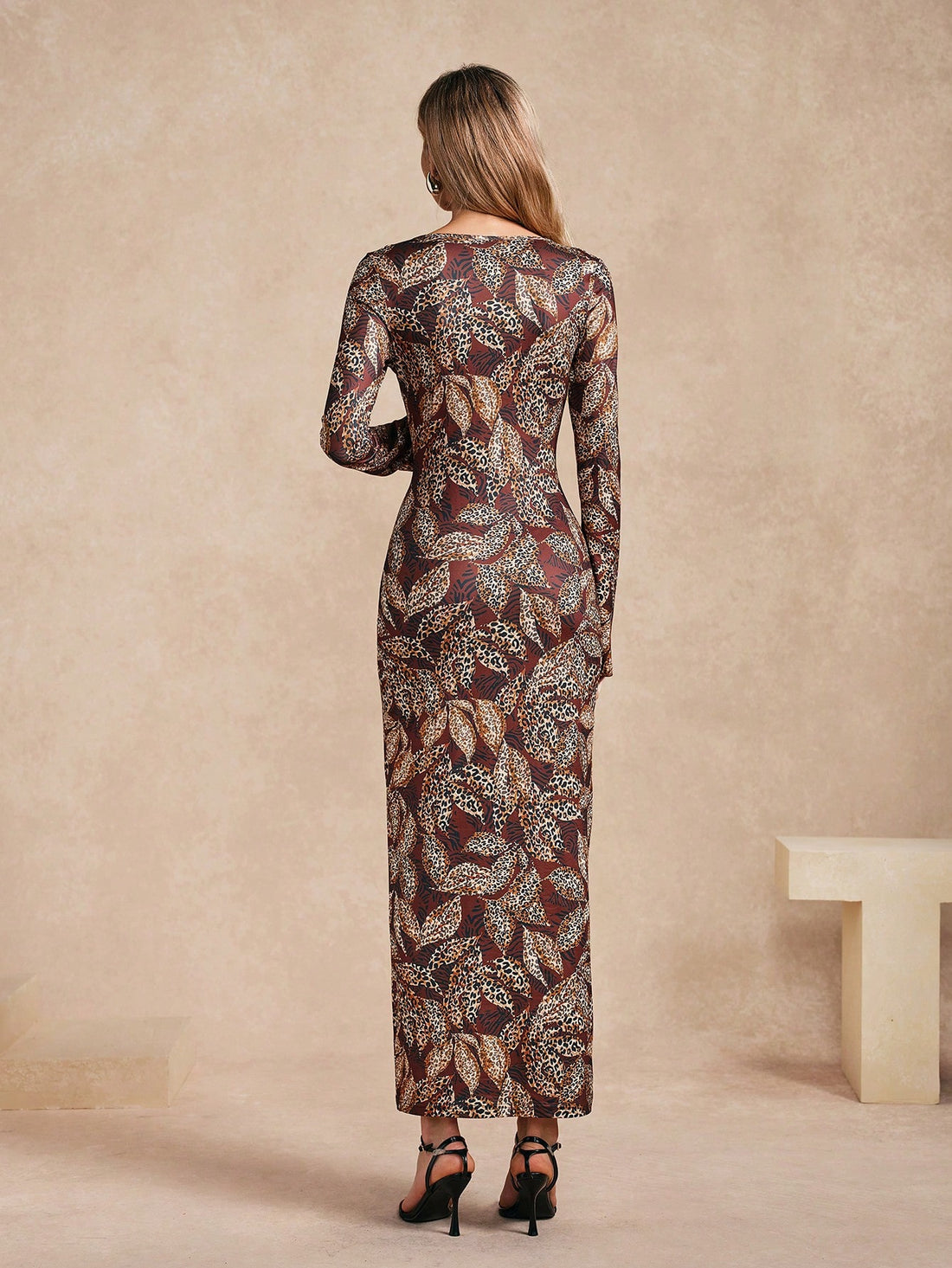 Introducing our Elegant Leopard Print Maxi Dress - a fierce and stylish addition to any wardrobe. Featuring a long sleeve design and fitted round neck, this dress is both elegant and edgy. Perfect for making a statement at any occasion. Rawr! (Only 45 words!)