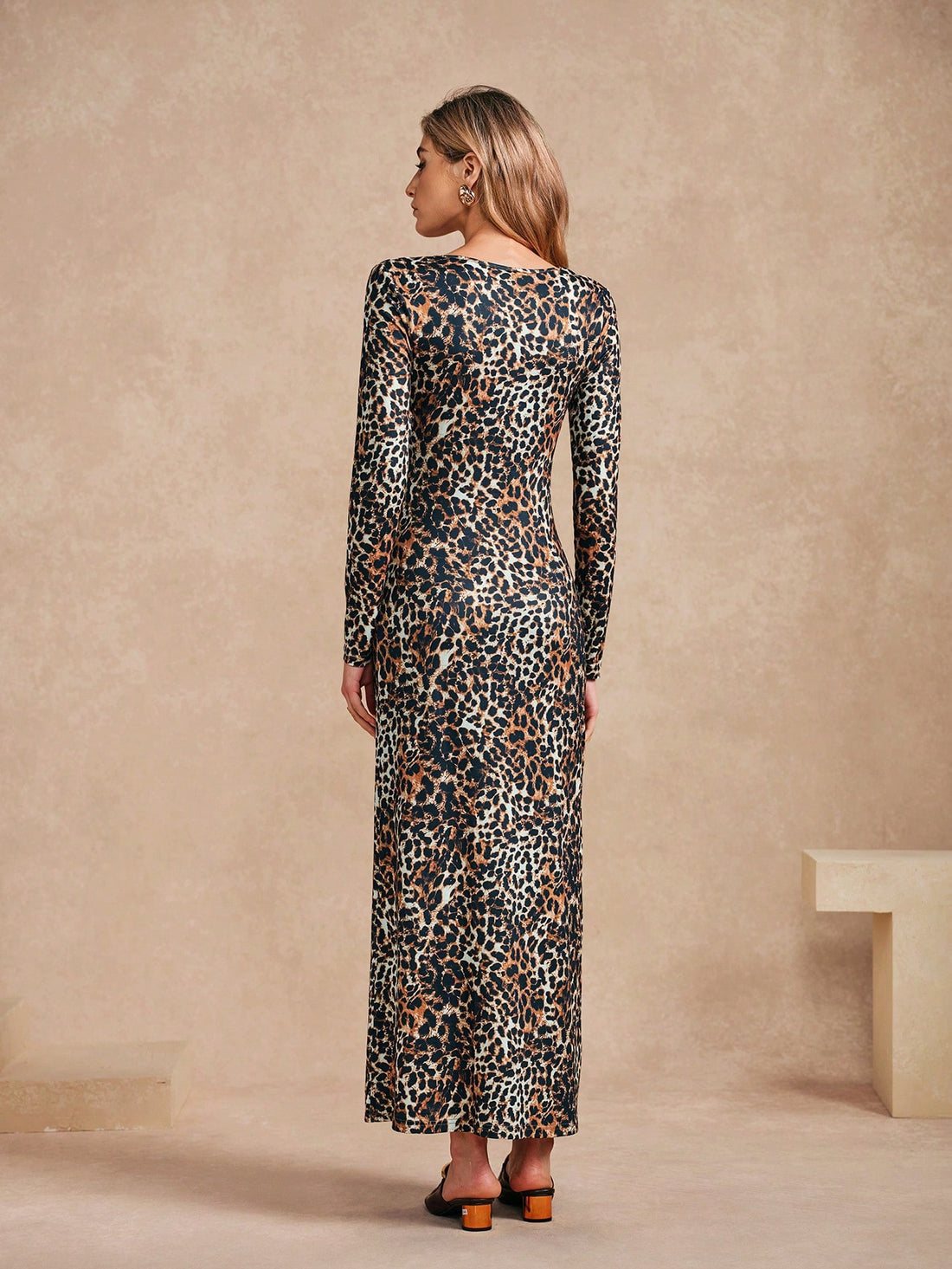 Unleash your wild side in this trendy leopard print dress. With a sexy hollow out design and flattering maxi length, you'll be the life of the party. Perfect for bold fashionistas looking to make a statement. (Meow!)