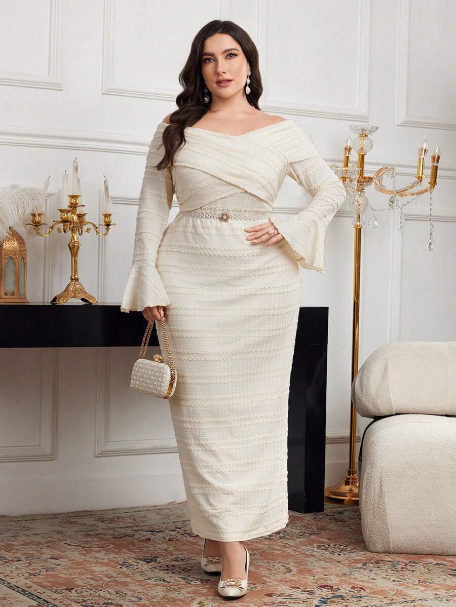 Turn heads with this elegant off-shoulder plus size dress, perfect for evenings that call for a little extra flair. Its dramatic flare sleeves and flowing silhouette bring a playful yet sophisticated vibe, while the solid color keeps it sleek and versatile. Whether it’s a gala or a special night out, this long gown combines comfort with style for a confident, radiant look.
