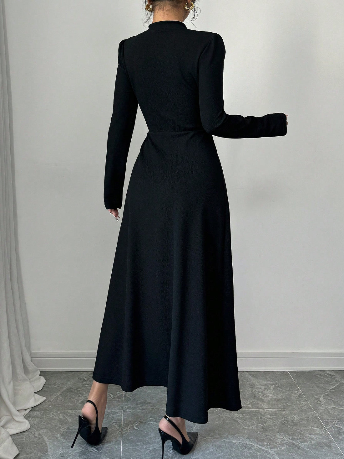 Unleash your inner fashionista with this Chic Retro Elegance maxi dress! Featuring a unique black and white patchwork design, this dress is perfect for making a statement. The playful bubble sleeves add a touch of whimsy to this elegant piece. Step out in style and turn heads with this must-have dress.