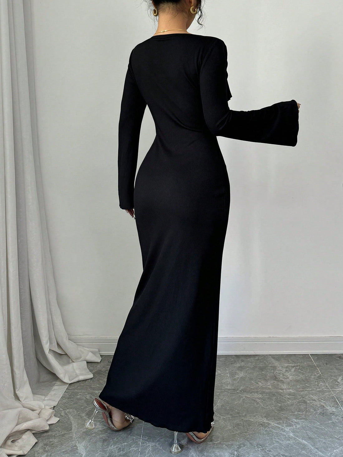 Get ready to turn heads with this chic midi dress that features a ruffled v-neckline and a stylish waist slit. Perfect for any evening occasion, this dress will add a touch of elegance to your wardrobe. Stand out from the crowd and make a statement with this fashionable and playful dress.