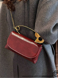Add timeless elegance to your wardrobe with this vintage burgundy shoulder bag for women. Designed with a rich burgundy finish and a sophisticated decorative brooch, this versatile handbag blends classic charm with modern functionality, making it a stylish choice for both everyday wear and special occasions.