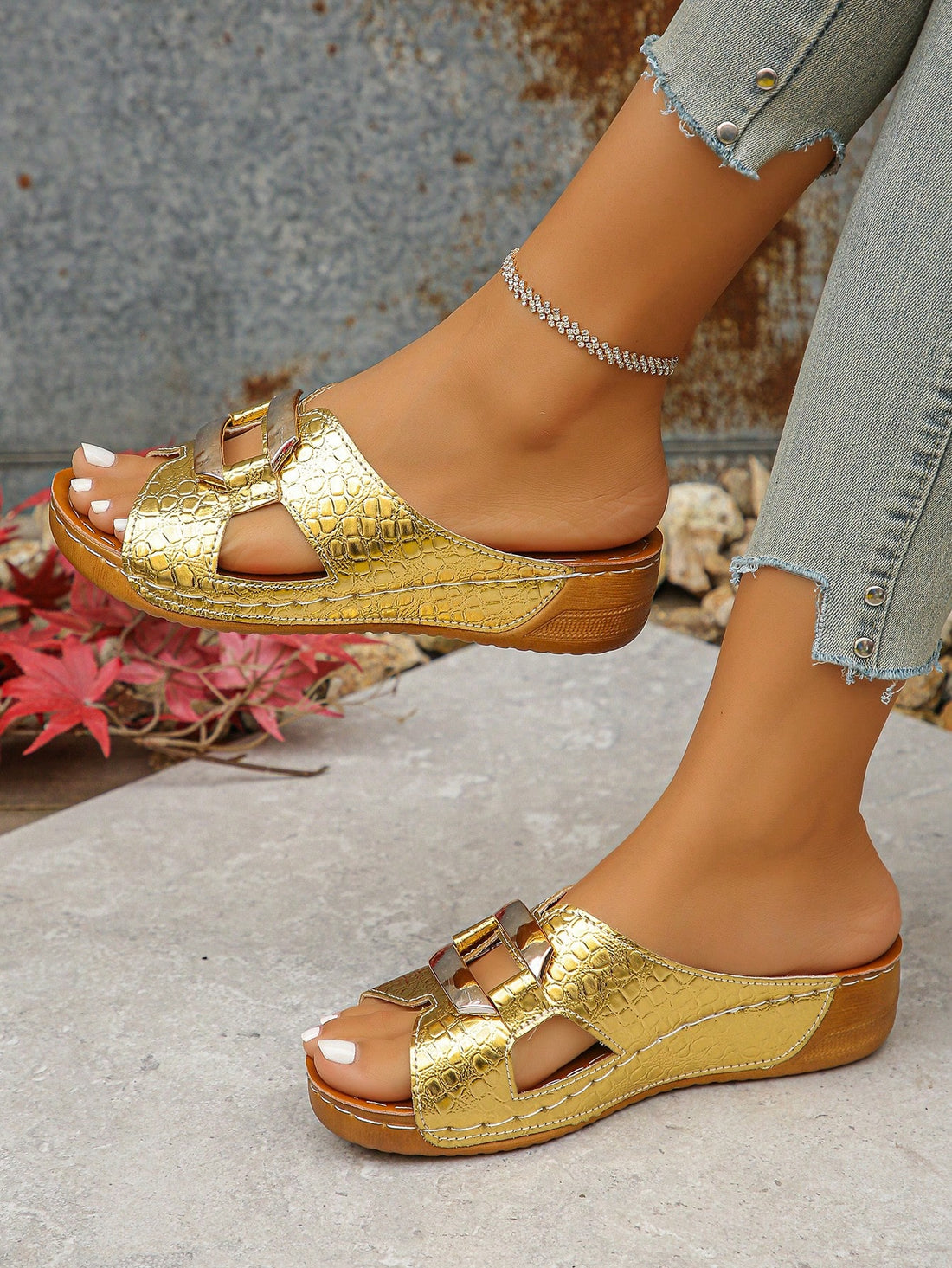 Elevate your summer style with these chic gold platform wedge sandals. Featuring a trendy crocodile pattern and metal accents, these sandals offer both fashion and function. The platform wedge provides added height and comfort, while the crocodile pattern adds a touch of edginess. Perfect for any summer outfit.