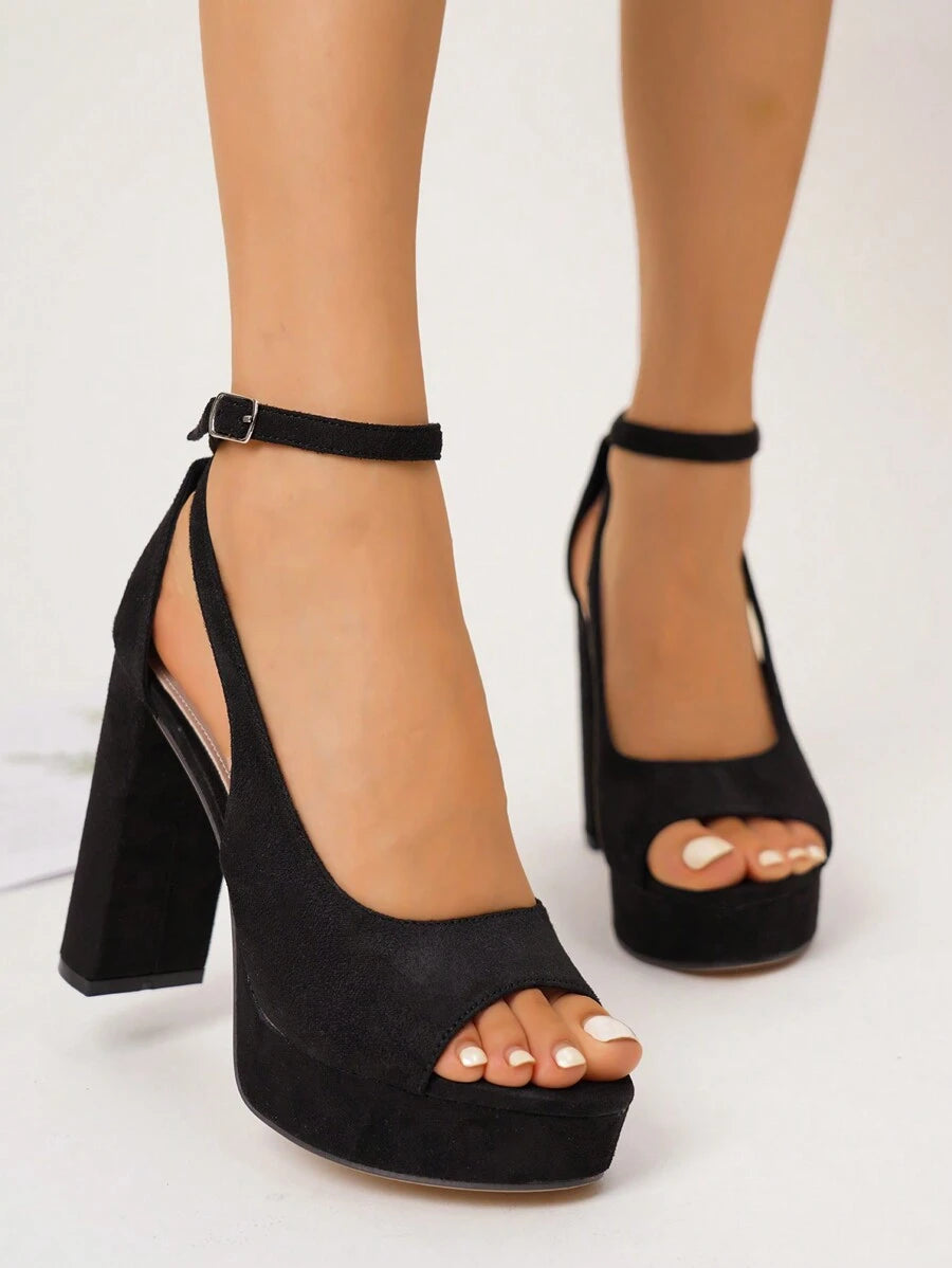 Step into the spotlight with these stunning silver platform sandals that blend glamour with modern edge. The shimmering metallic finish catches every light, while transparent straps create an illusion of floating elegance on your feet. The elevated platform adds confidence to your stride without sacrificing comfort, making these the perfect companion for nights out, celebrations, and moments when you want to feel absolutely fabulous. Whether you're dancing till dawn or making a grand entrance, these sandals