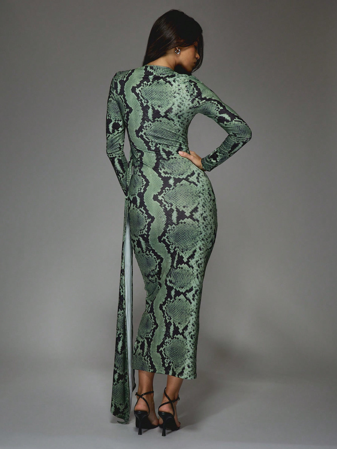 Get ready to slither into style with our Stylish Snake Print Asymmetric Maxi Dress! With its unique snake print design and eye-catching ruched sides, you'll be sure to turn heads. And let's not forget the daring side slit for a touch of sass. It's a must-have for any fashion-forward wardrobe!