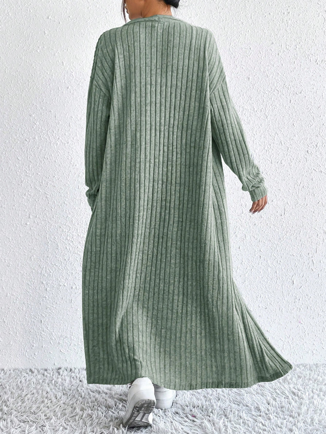 Effortless Elegance with this minimalist knit set. The sleeveless dress provides a chic and breezy look, while the long sleeve cardigan adds a touch of cozy elegance. Keep it simple, yet stylish!