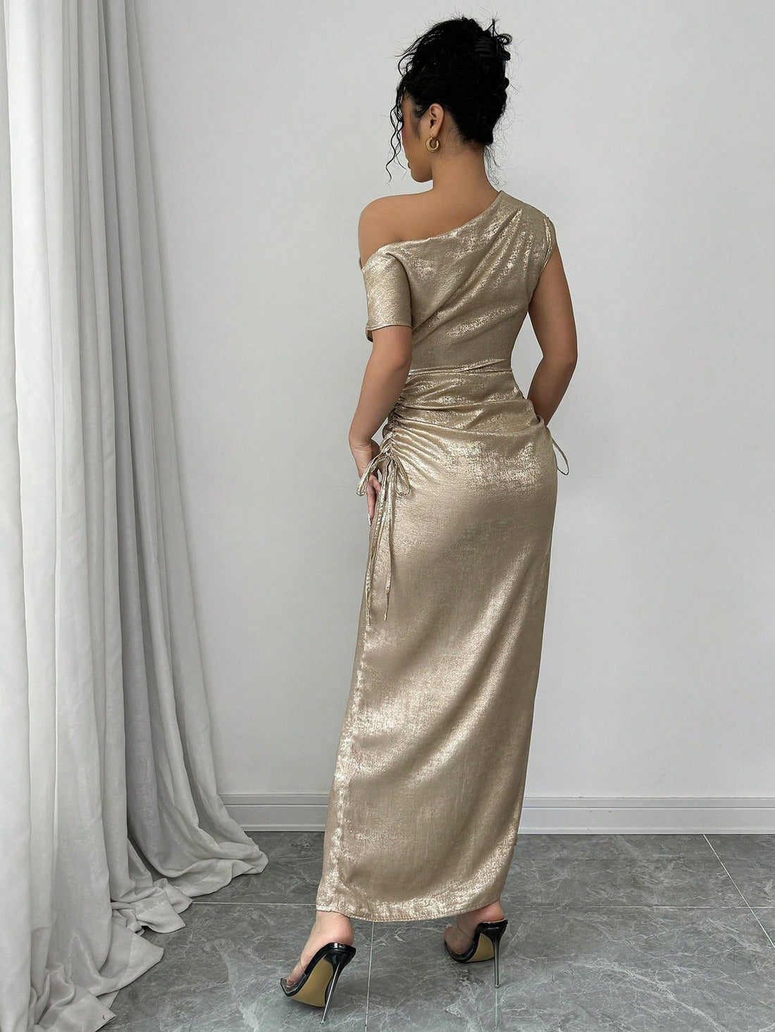 Elevate your elegant style with our Chic Iridescent Cinched Waist Asymmetric Neck Dress. The cinched waist flatters your figure, while the asymmetric neck adds a touch of uniqueness. Made for the stylish woman, this dress is perfect for any event and will make you stand out in a crowd!