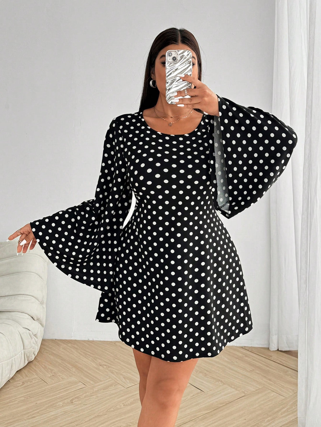 Get ready to make a statement with our Elegant Polka Dot Backless Bell Sleeve Dress! Designed with a casual round neck and a fitted style, this dress will hug your curves in all the right places. The playful polka dot pattern and backless design add a touch of whimsy to this sophisticated piece.