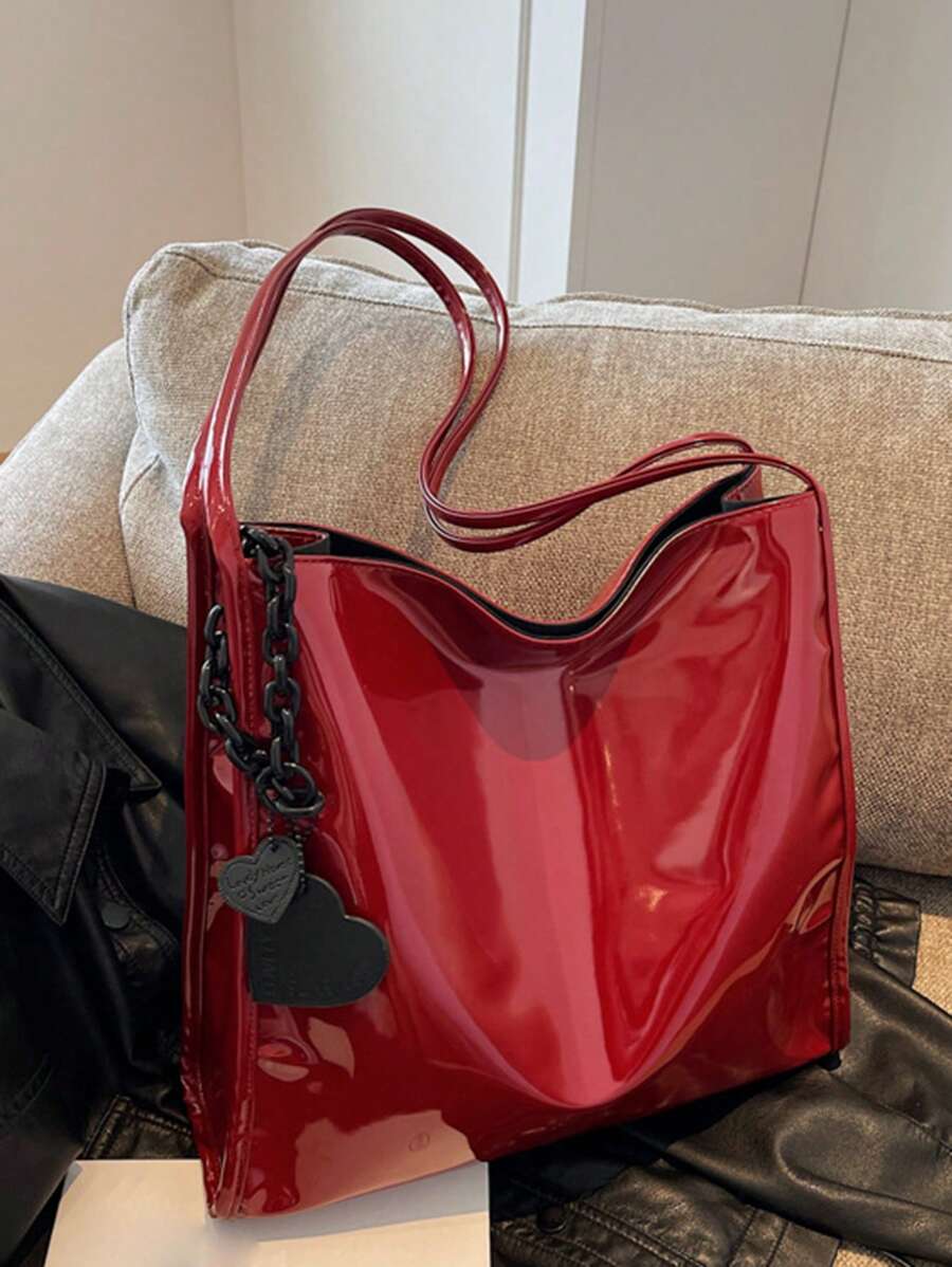 Meet your new favorite sidekick: a chic patent leather tote that’s as roomy as your weekend plans. This stylish shoulder and bucket bag in a trendy solid color lets you carry all your essentials—and then some—without sacrificing an ounce of flair. Perfect for daily use, it combines fashion and function effortlessly, making it the bag you’ll reach for again and again.