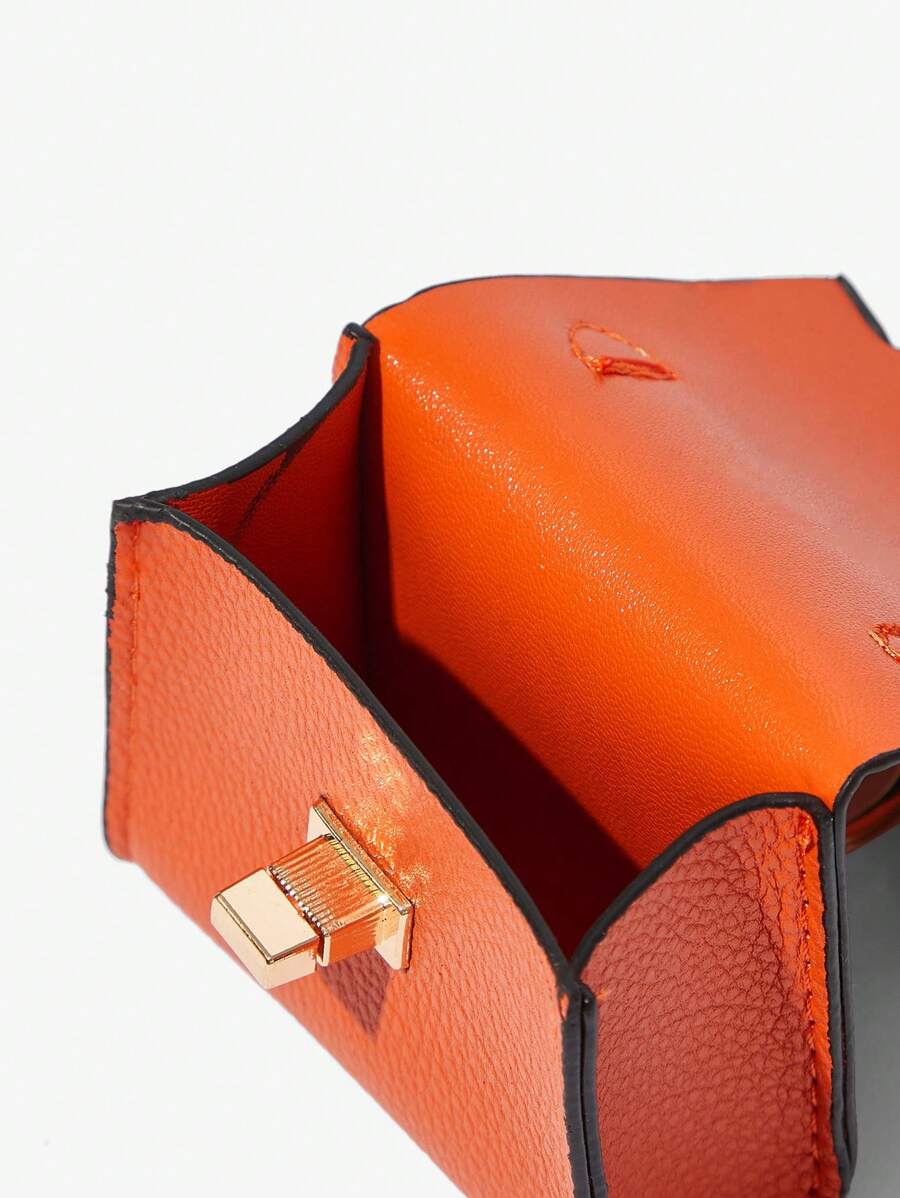 Close-up view of mini key ring holder keychain coin purse earphone pouch bag charm with chain strap, coin purse format, key ring detail for small-item storage