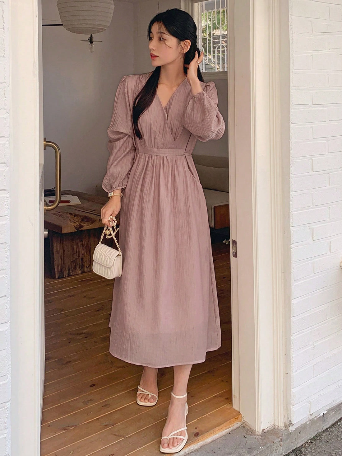 Experience a chic and playful vibe with our Gathered Mid-Length Dress. The cinched waist and v-neckline add a touch of elegance, while the gathered details provide a unique and flattering silhouette. Dress it up or down for a versatile and stylish look.