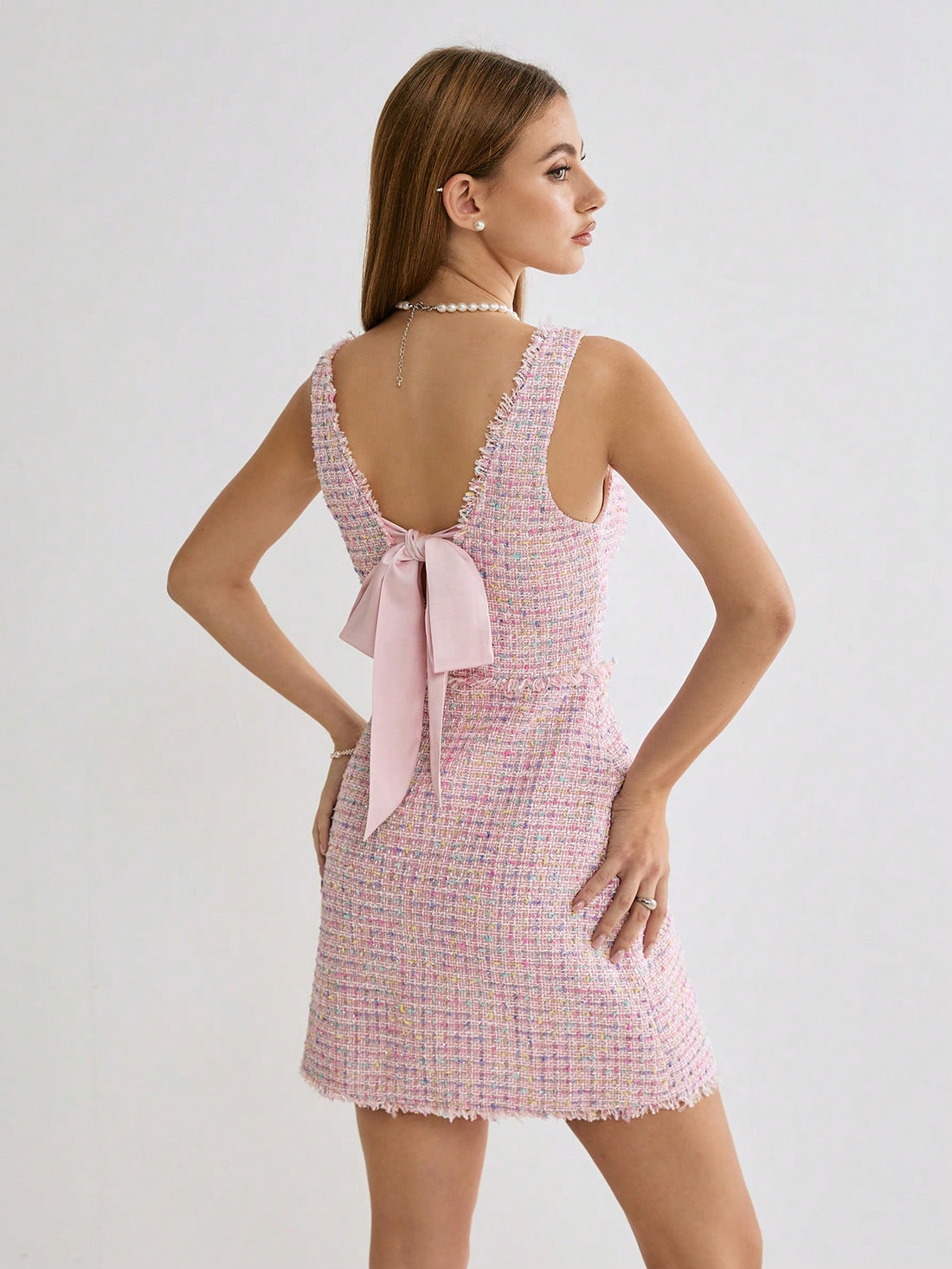 Get ready to enchant your special someone in our Chic Enchantment dress! Made from the softest pink plaid fabric, this fringed mini dress is the perfect choice for a romantic occasion. The added bowknot detail adds a touch of playfulness and charm. Don't wait, grab yours today!