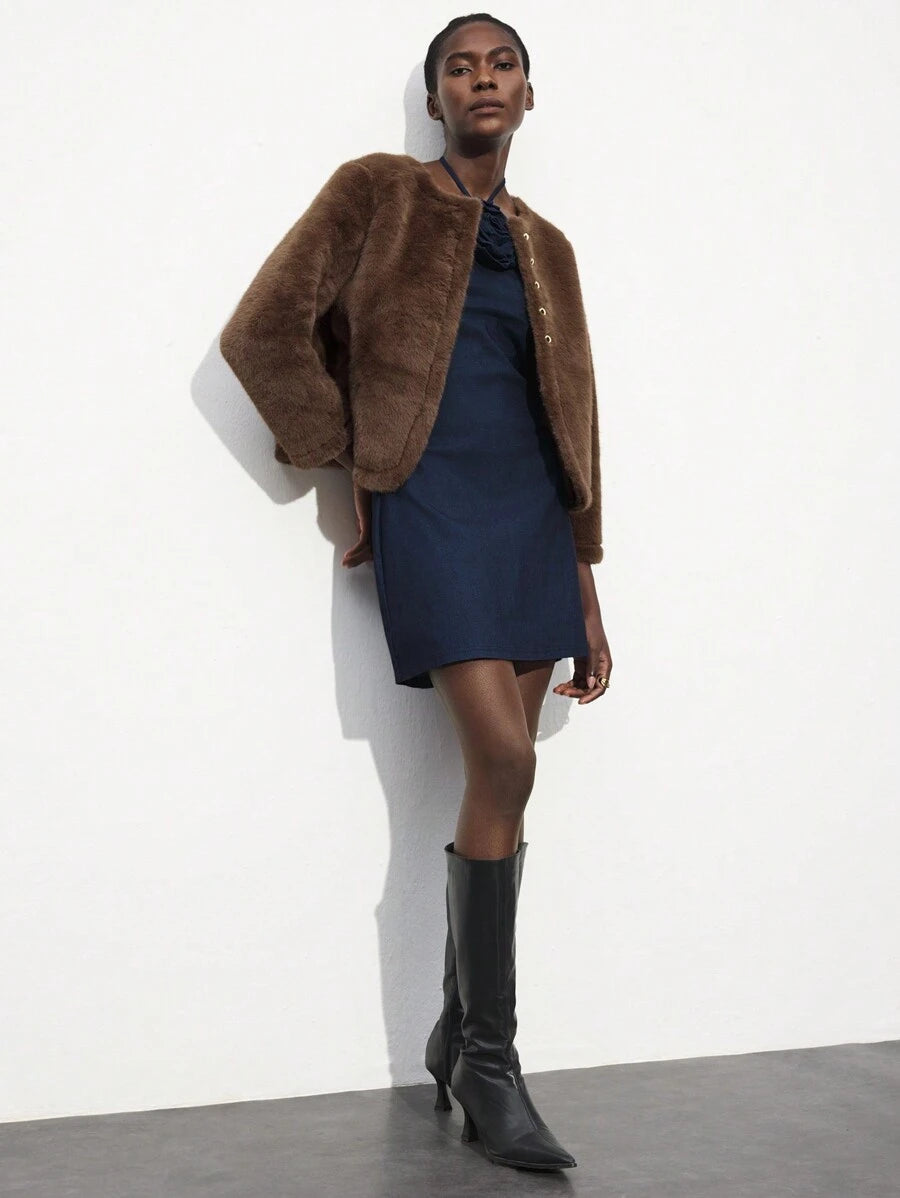 Turn heads effortlessly in this Elegant White Halter Neck Mini Dress, featuring a charming 3D rose collar that adds a whimsical touch. Its sleek silhouette suits every season and occasion, making it your go-to piece for playful yet sophisticated style. Whether it's a sunny brunch or a sparkling evening event, this dress promises to make you bloom with confidence.