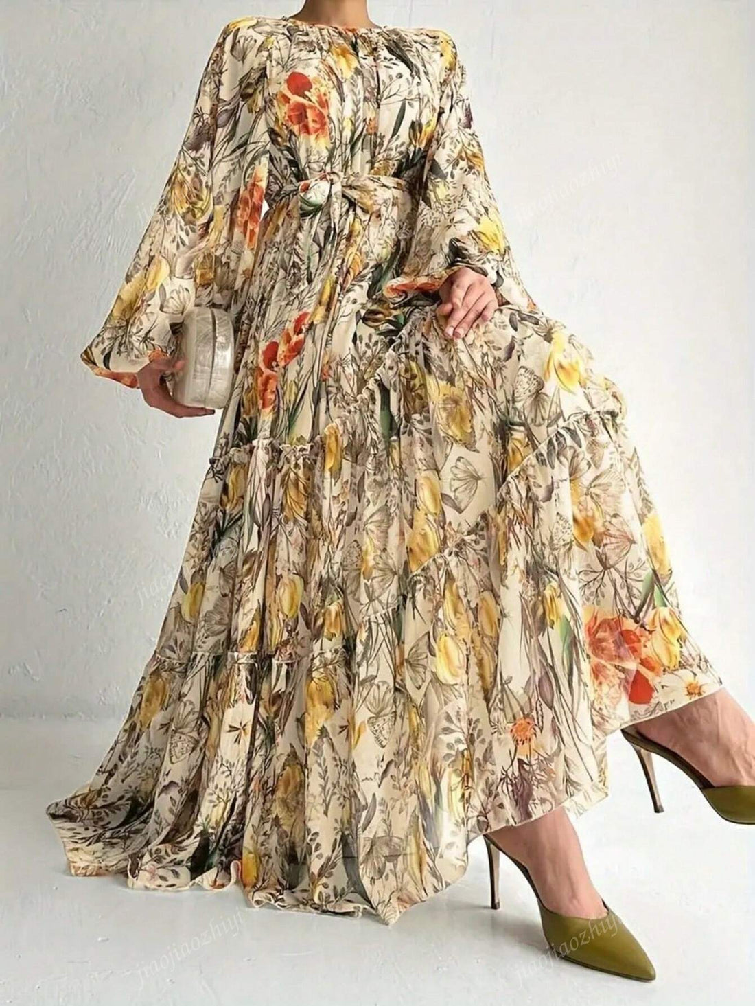 Twirl into elegance with our Floral Print Lantern Sleeve Dress! This Arabic-inspired beauty combines whimsical lantern sleeves with a flirty ruffle hem that dances with your every move. The charming floral pattern adds just the right amount of fun to your wardrobe, making it perfect for turning heads and collecting compliments wherever you go!