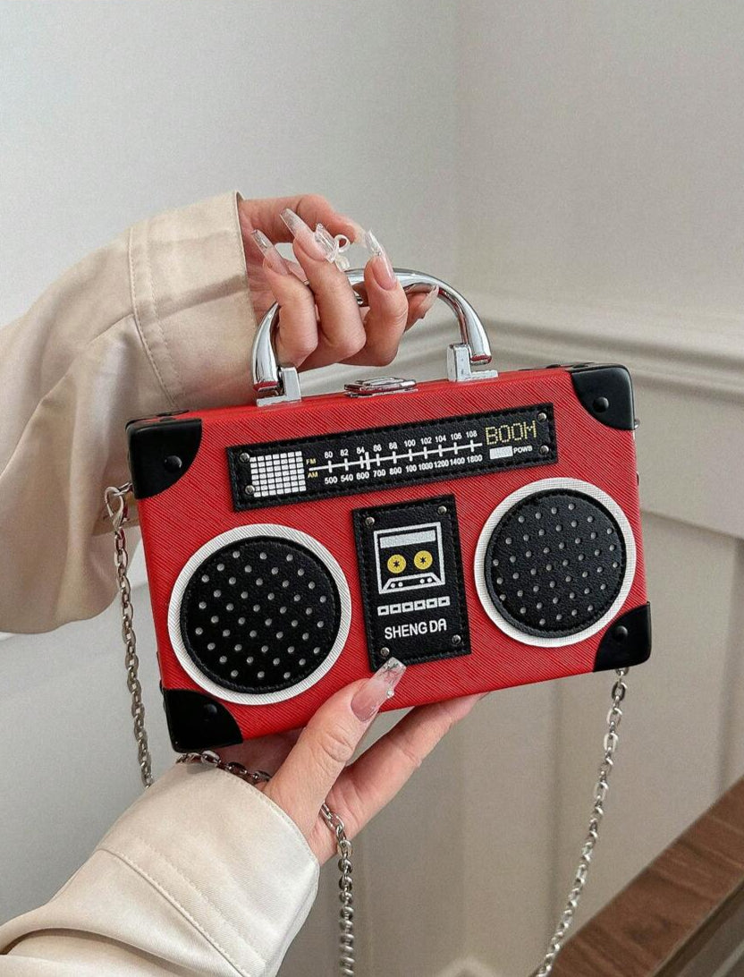 Turn heads with this Chic Purple Radio-Shaped Handbag, a playful nod to music lovers everywhere. Its unique gift box style blends retro charm with modern flair, making it the perfect statement piece for any outfit. Carry your essentials in style while showing off your love for all things musical!