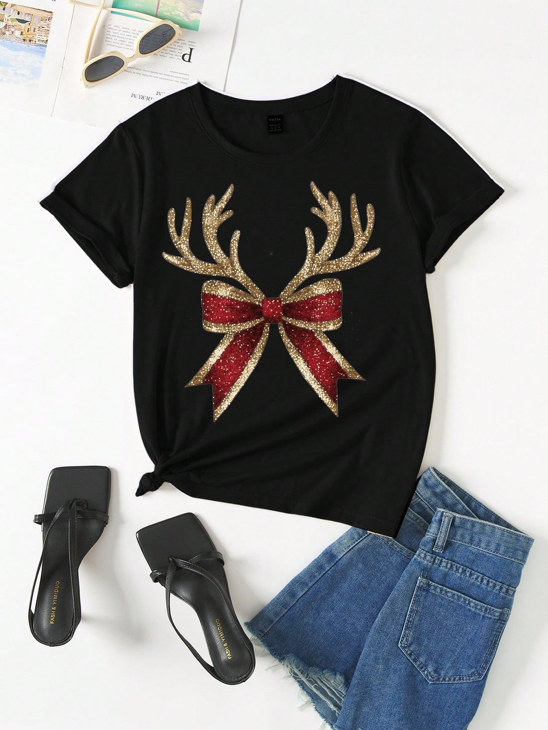 Show off your festive charm with this adorable t-shirt! The red plaid pattern, bowknot detail, and deer horn print will make you stand out in any holiday gathering. Plus, the short-sleeves keep you cool and comfortable while you spread holiday cheer. Get yours now!