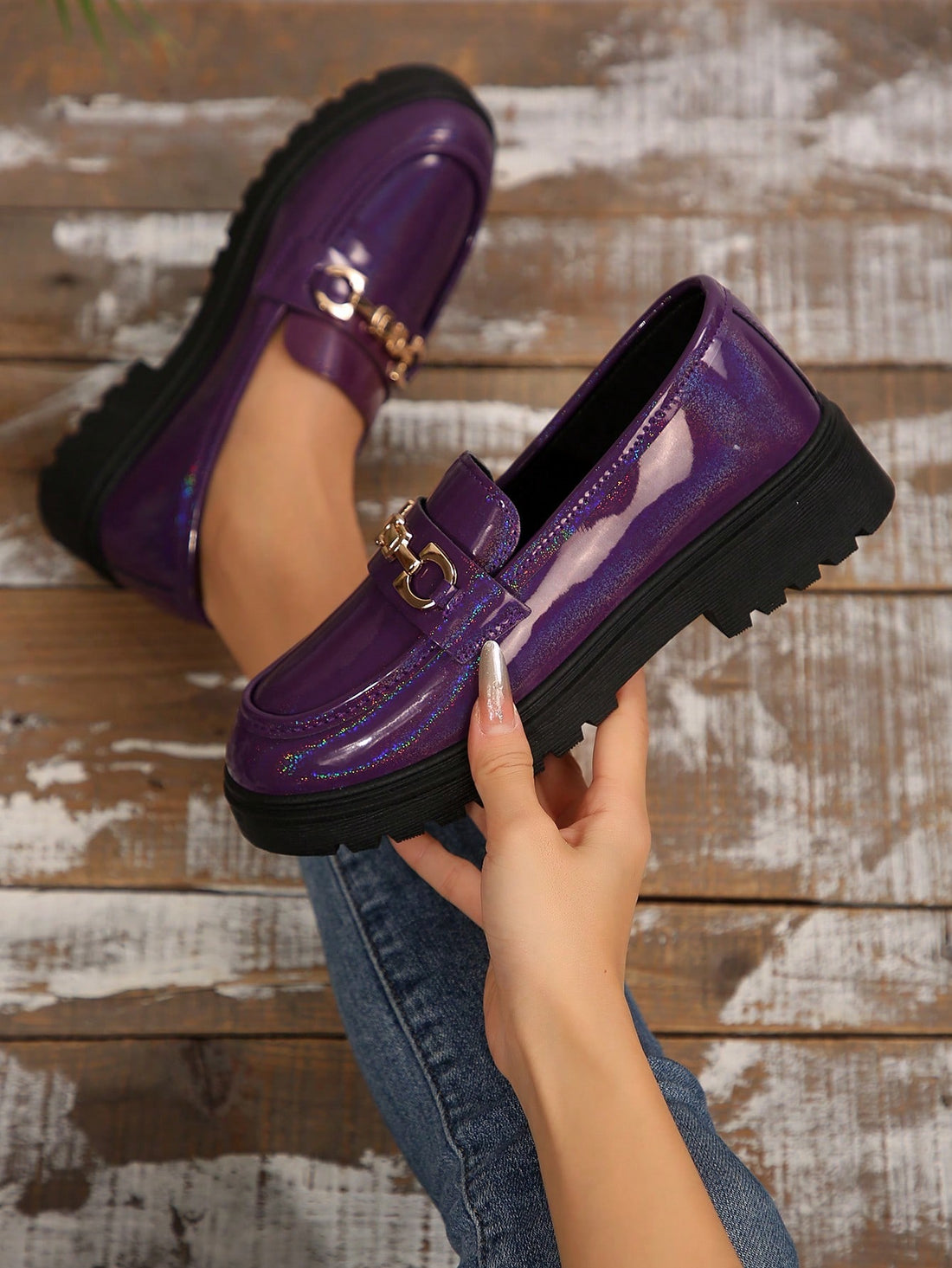 These chic patent loafers are perfect for all seasons with their thick sole and metal chain accent. Slip them on for a stylish look that will elevate any outfit. Who needs heels when you have these perfect year-round flats? (And they're patent, so they'll always look shiny and new!)