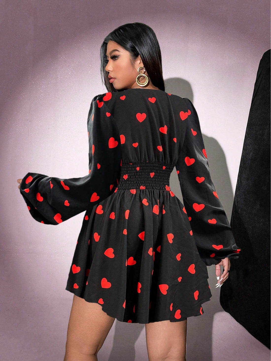 Effortlessly chic in this heart print dress! This plus size dress features a flattering v-neck and a fun heart print, perfect for adding some personality to your casual style. Look and feel fabulous in this easy-to-wear dress!